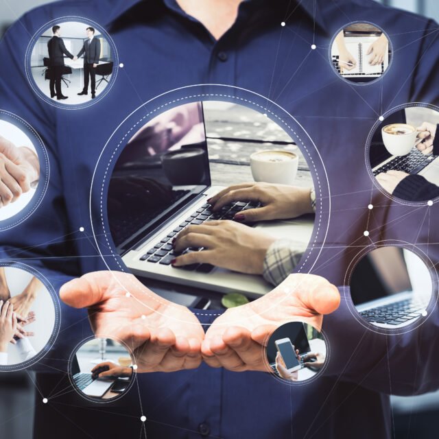 Work in progress concept with online organization business processes at the same time: working on laptop, using mobile device, business meeting, coffee break and teamwork on man palms background.